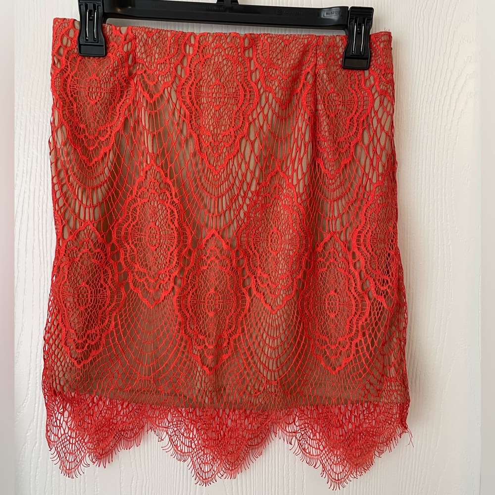 NWT San Joy lace skirt size large. Red orange lace skirt with nude lining